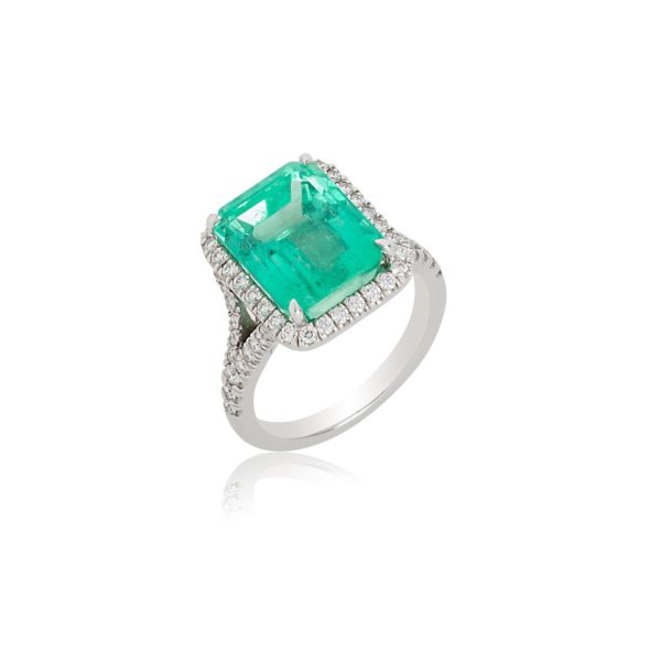 18ct white gold emerald ring with diamond surround and shank