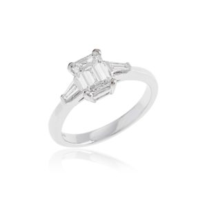 Platinum emerald cut diamond ring with tapered baguette