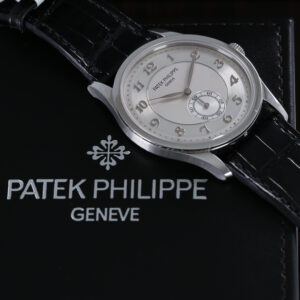 Patek Philippe watch on black background FEATURE