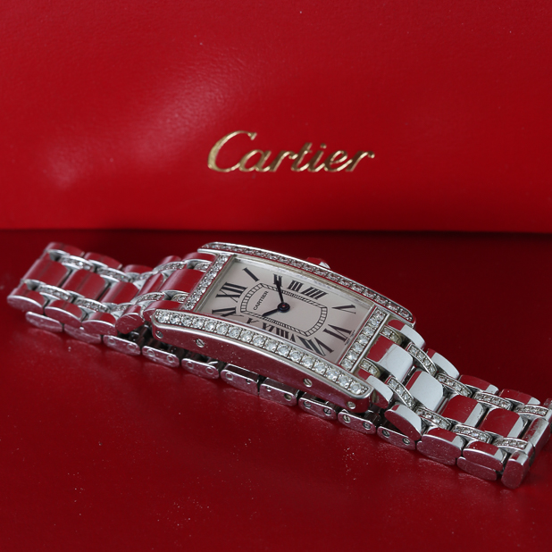 silver-cartier-watch-on-red-background